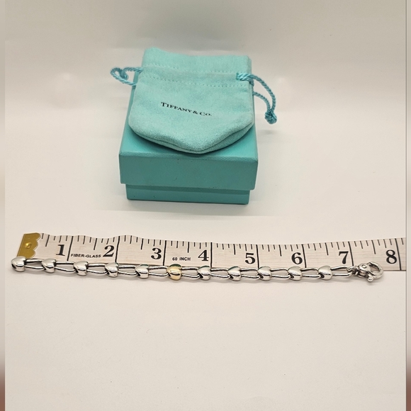 Tiffany & Co. Silver Bracelet with Gold Heart Accent